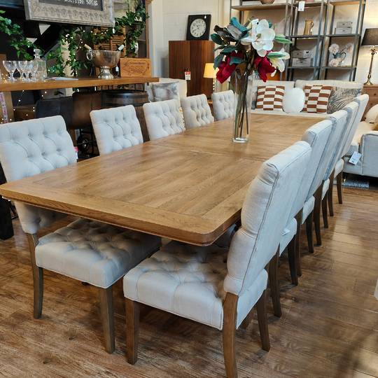 The Castle Light Oak Extension Dining Table 2.1m - 2.9m + 10 Casa Dining Chair Linen Cream Set